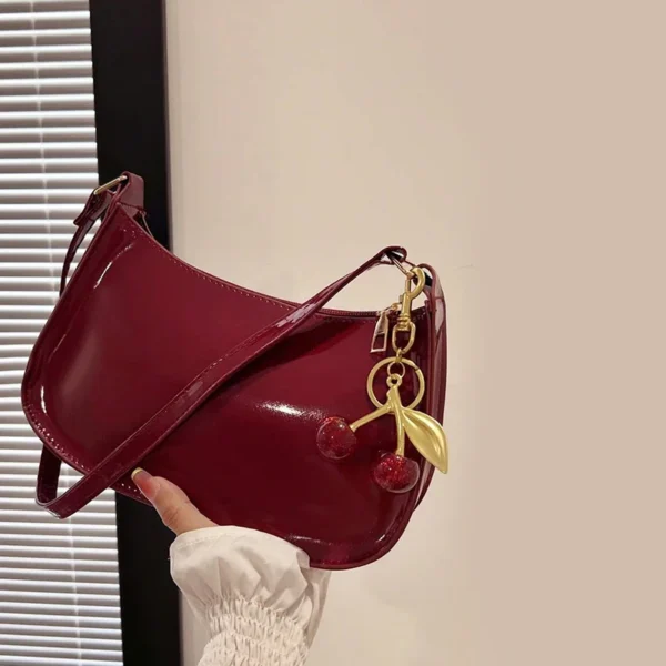 Bolso de mano de piel sintética para mujer, bolso de hombro con colgante de cereza de Color sólido.